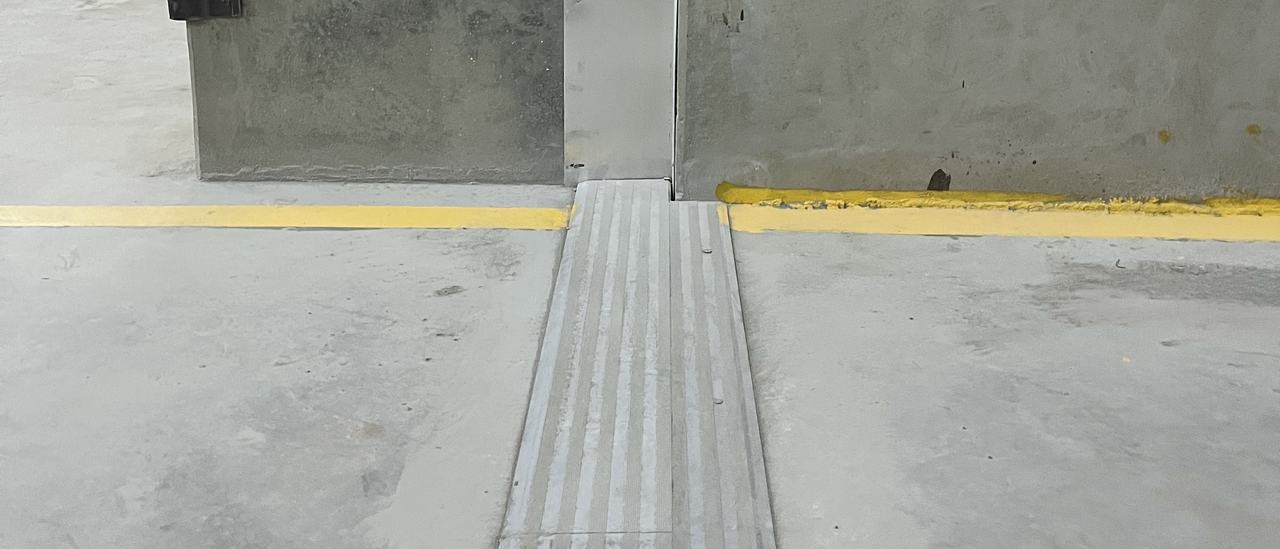 A floor expansion joint across a basement car park, meeting a column joint, Bengaluru